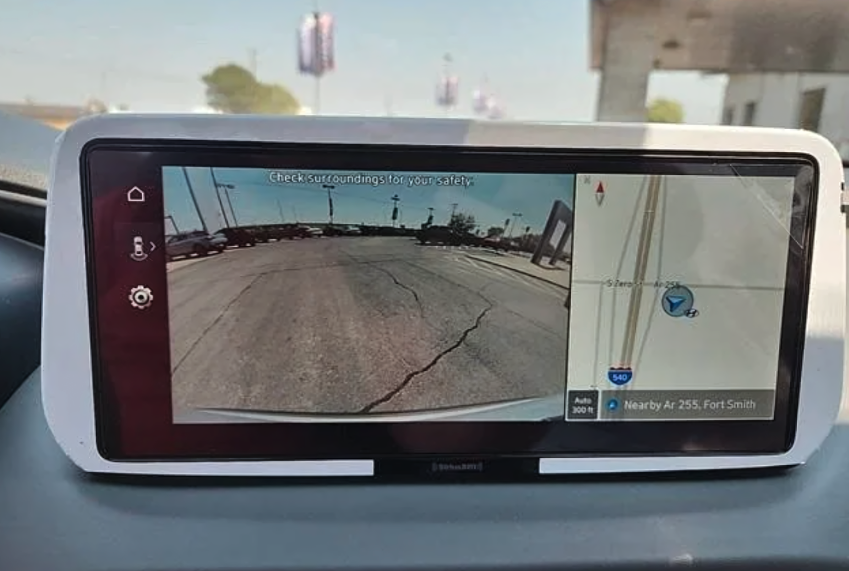 Hyundai vehicle infotainment screen showing rearview camera and navigation map